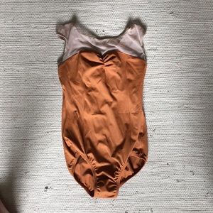 Mustard colored leotard with cap sleeves
